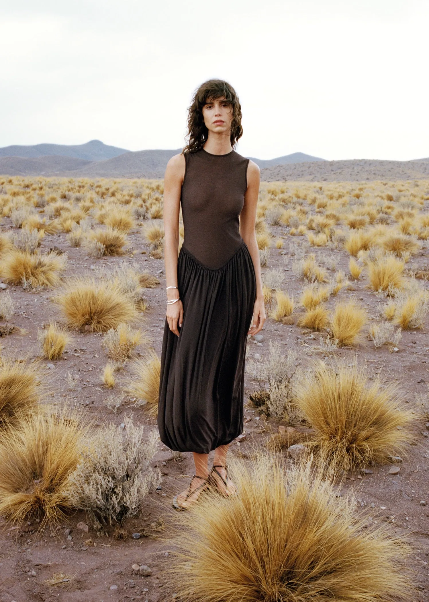 Semi-transparent dress with puffed hem
